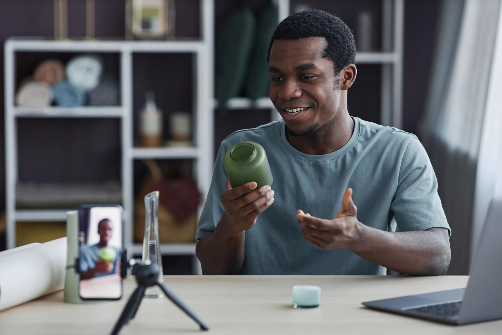 man-influencer-holding-branded-product-with-label-on